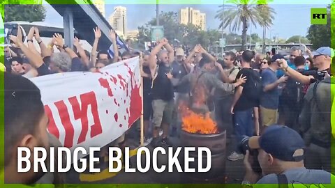 Relatives of Israeli hostages block traffic on major bridge in Tel Aviv