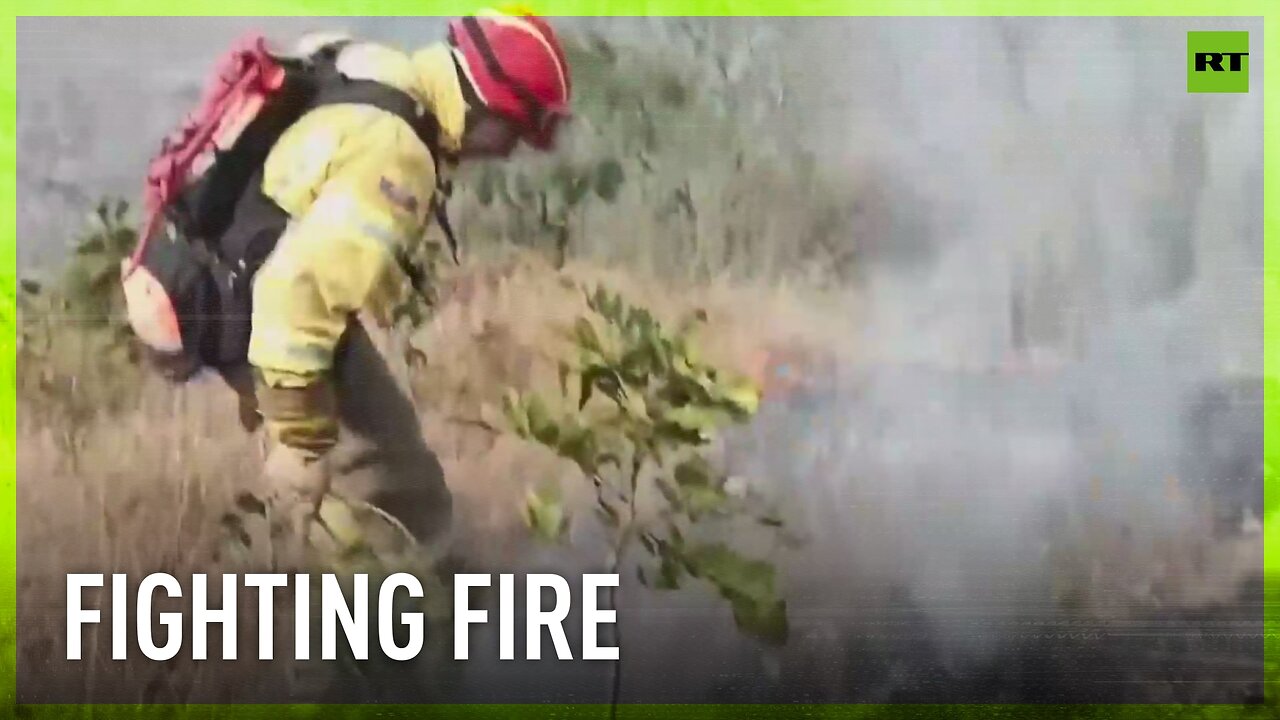 Firefighters battle with massive wildfire in Ecuador