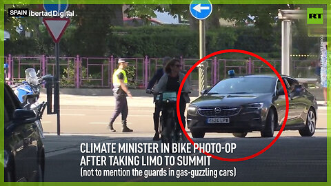 Climate minister in bike photo-op after taking limo to summit