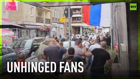 Crazy soccer fans throw chairs at each other ahead of England-Serbia match