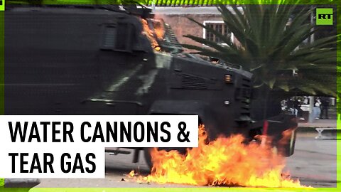 Riot police clash with protesting students in Bogota