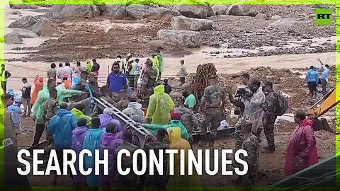 Rescuers work through mud and debris from landslides in India