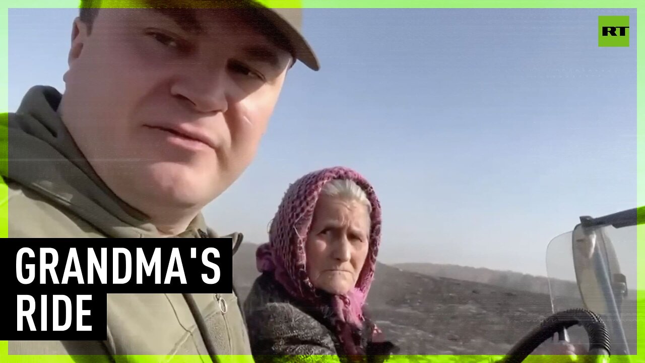 Badass Babushka upstages governor driving around burnt out village