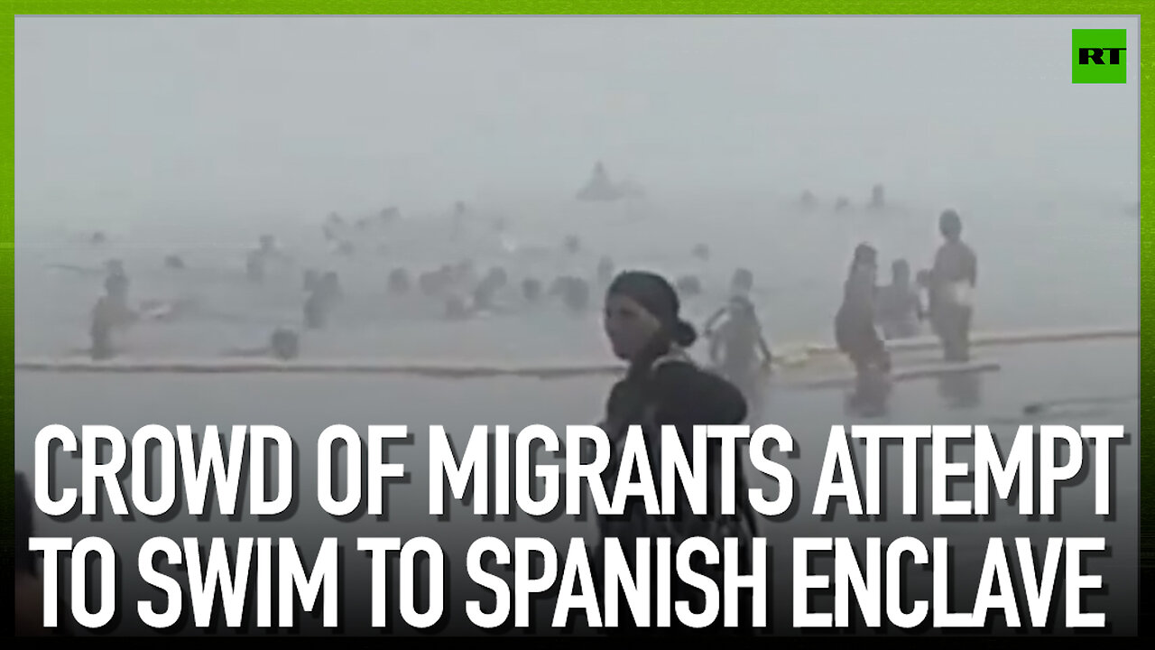 Crowd of migrants attempt to swim to Spanish enclave