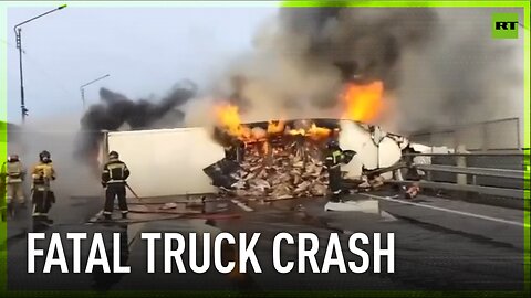 Driver killed as burning cargo truck falls from bridge in Russia