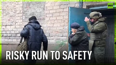 Russian troops evacuate civilians to safety after taking control of a frontline town