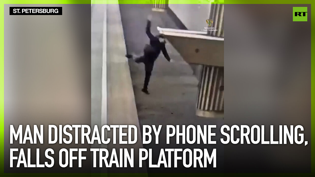 Man distracted by phone scrolling, falls off train platform