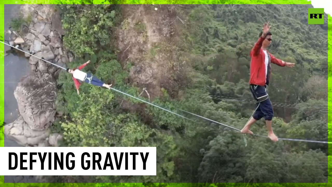 Chinese athletes walk tightrope over rainforest