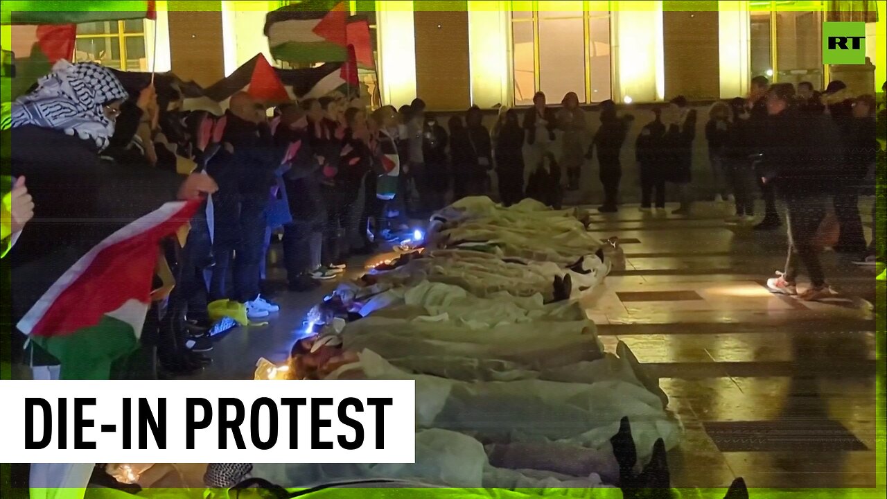 White-clad protesters resembling body bags lying in central Paris to remember Gaza victims