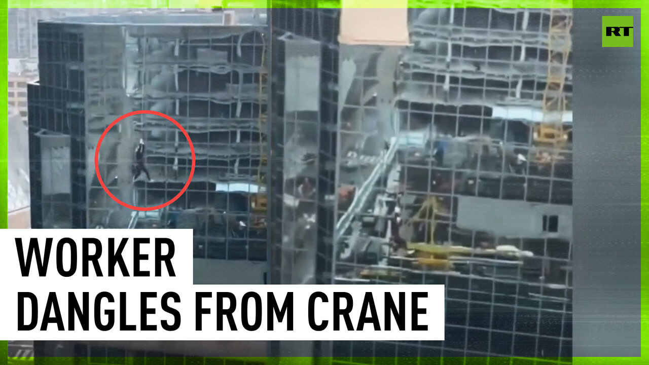 ‘How the f*** this happened?’ Construction worker left dangling from high-rise crane