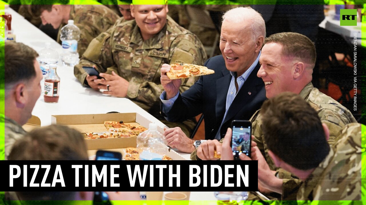 Biden eats pizza with US troops in Poland