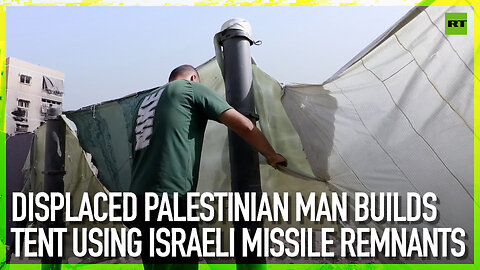 Displaced Palestinian man builds tent using Israeli missile remnants