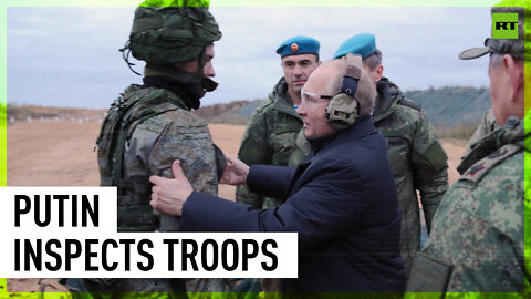 Putin fires rifle while inspecting training of mobilized recruits