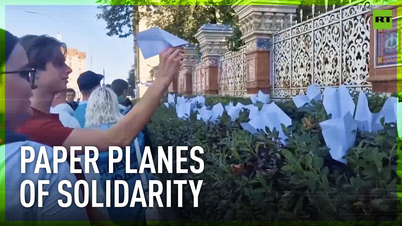 People lay paper planes at French embassy in Moscow