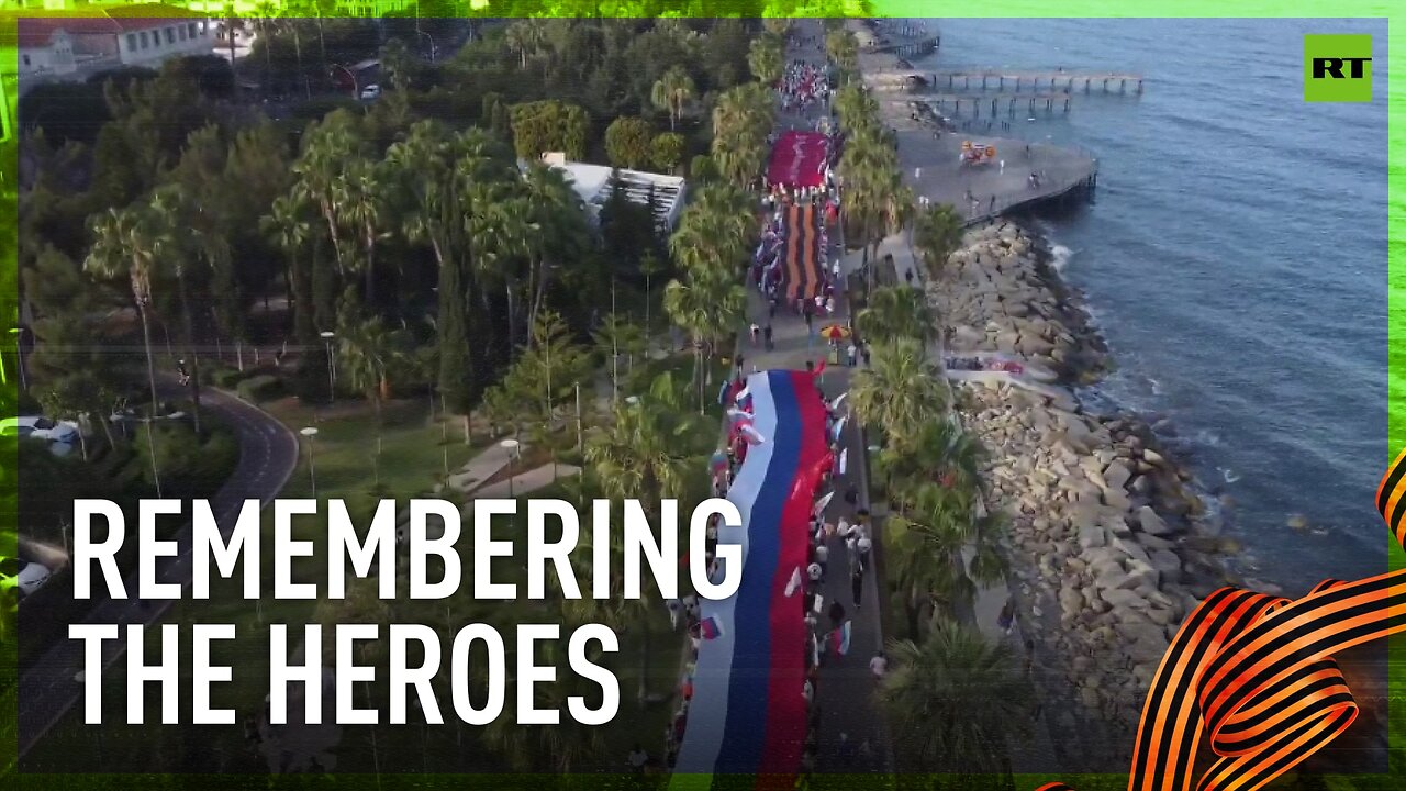 Crowds march with huge Russian flag as Cyprus celebrates Victory Day