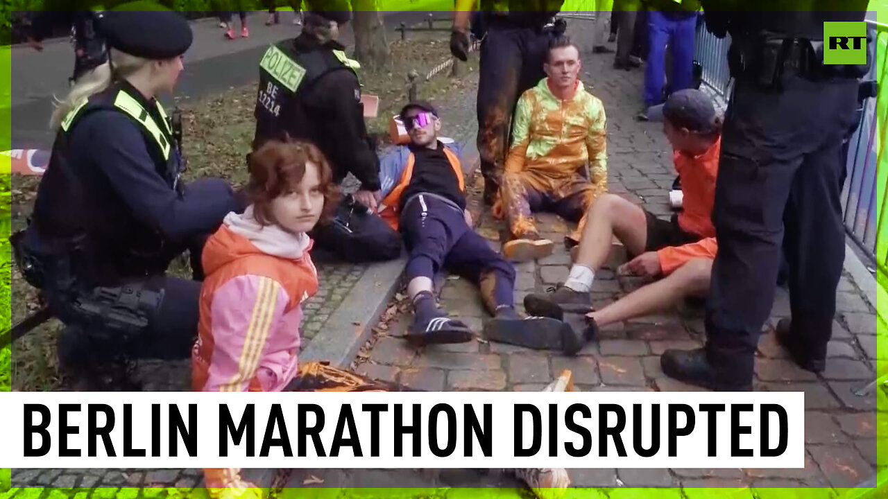 Environmental activists disrupt Berlin marathon with paint protest