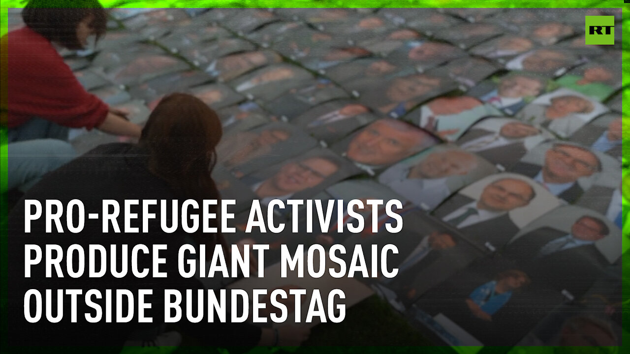 Giant mosaic made of politicians’ portraits produced by pro-refugee activists in Berlin