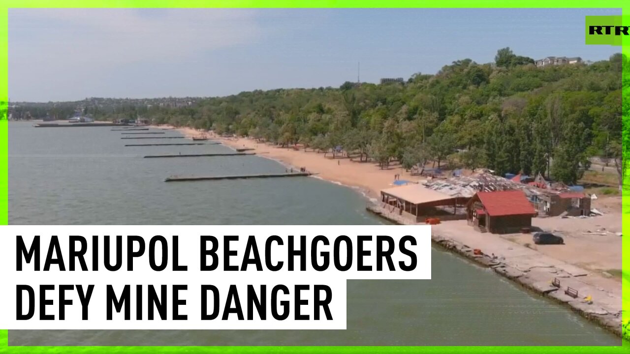 Mariupol beachgoers defy mine danger to swim in sea