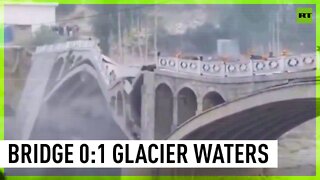 Pakistani Hassanabad bridge collapses as melted glacier's water brings floods