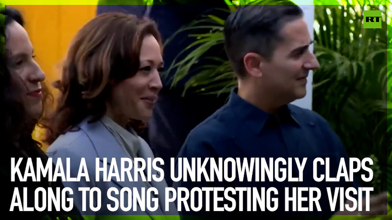 Kamala Harris unknowingly claps along to song protesting her visit