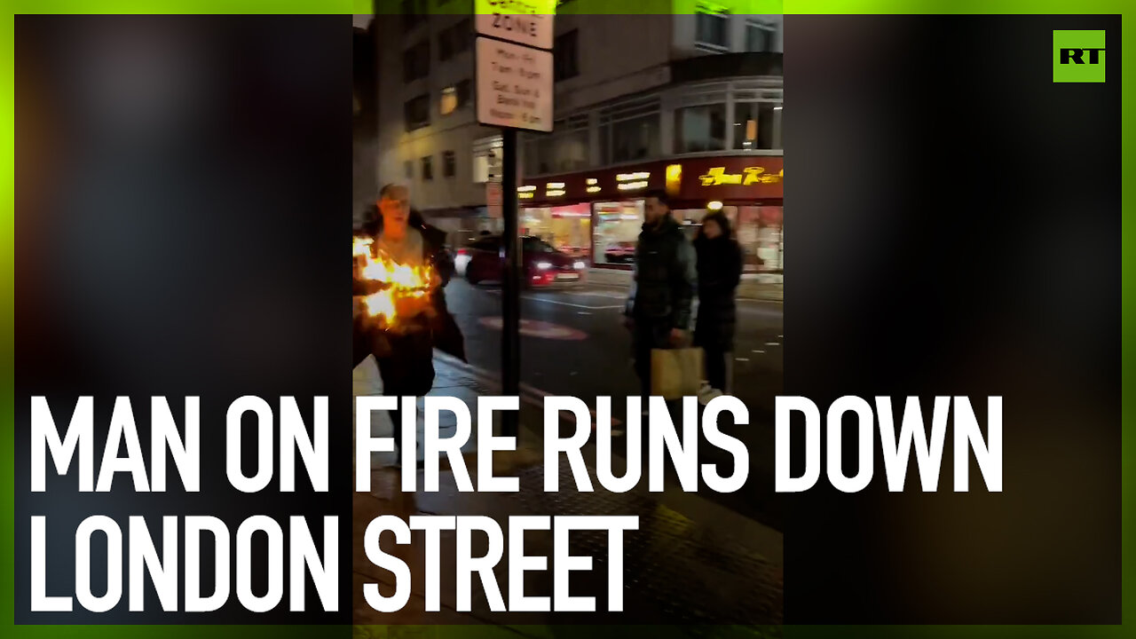 Man on fire runs down London street