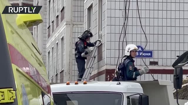 EMERCOM workers rescue a cat from gas-blast-rattled residential building in Noginsk, Russia