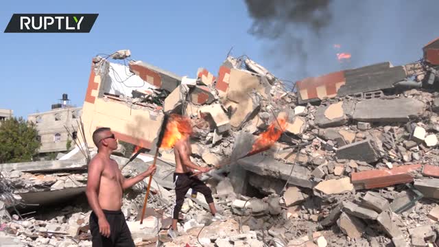 Fire acrobats send 'message of life' standing on rubble in Gaza