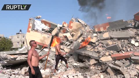 Fire acrobats send 'message of life' standing on rubble in Gaza