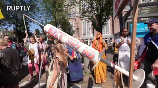 Tens of thousands march against vaccine passports in Amsterdam