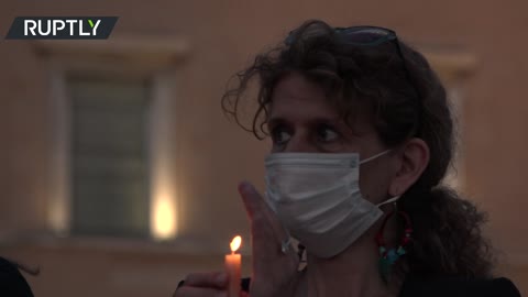 Candlelight vigil against femicide held outside Greek parliament in Athens