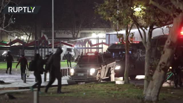 Chilean police use water cannons to disperse protesters demanding freedom for detainees