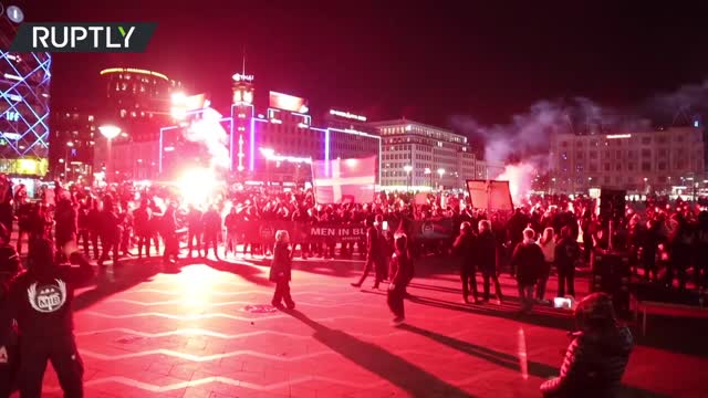 Red flares & fireworks | 'Men in Black' march against COVID-19 restrictions