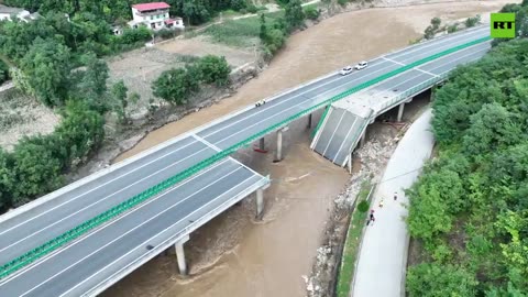 China highway bridge collapses in flooding