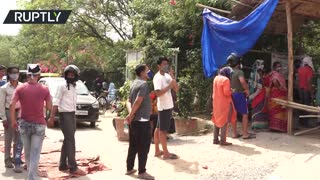 People queue for free oxygen cylinders Amid COVID catastrophe in India