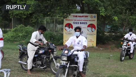 That's a record! Karate master withstands 1,222 bikes driving over his chest in India