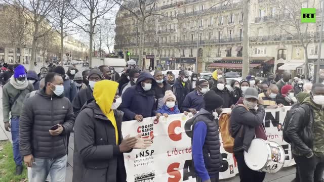 DOZENS of undocumented migrants demand legal status in Paris