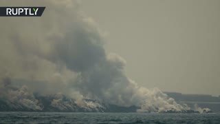 La Palma volcano’s lava creates molten rock tongue as it hits the ocean