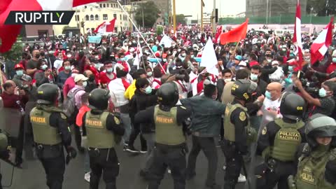 Peruvian presidential candidates supporters fight as they await final results of election vote