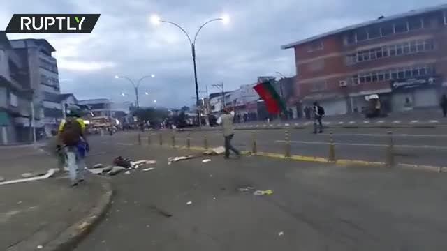 Officers shoot projectiles towards protesters in Colombia’s Cali during national strike