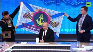 'Soldiers pass souvenirs to me': Putin shows a combat banner gifted to him by Russian marines