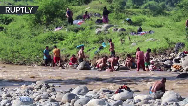 Members of a migrant caravan en route to the US border sleep on Huixtla’s streets