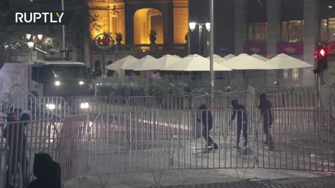 Demonstrators demanding the release of detainees water-cannoned in Santiago, Chile