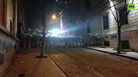 Georgian Parliament building lit up with fireworks set off by pro-EU protesters