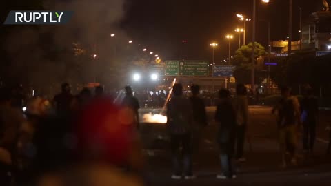 Anti-govt protesters and Bangkok police exchange fireworks and tear gas