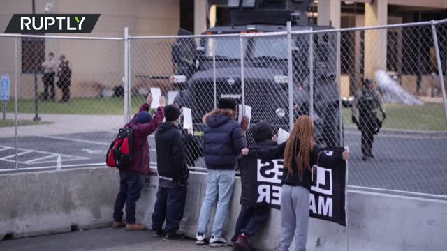 Protesters rally at police HQ in Brooklyn Center, Minnesota