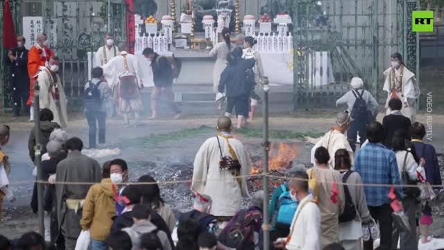 Buddhist monks fire-walk for peace in Japan