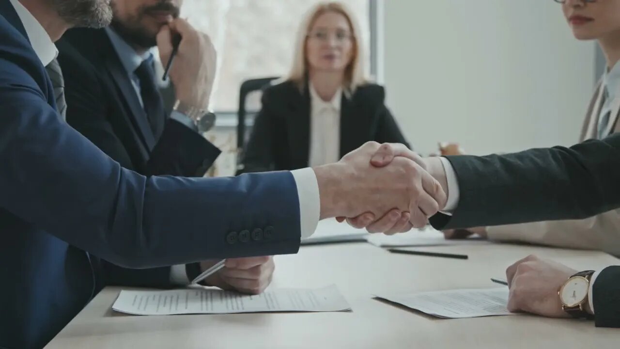 pan midsection slowmo shot of two businessmen with lawyers sitting by conference ta SBV 346564060 HD