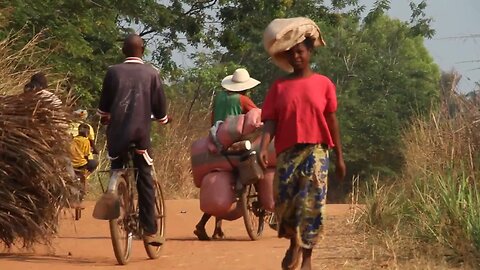 african dirt road with bicycles and pedestrians SBV 300146990 HD