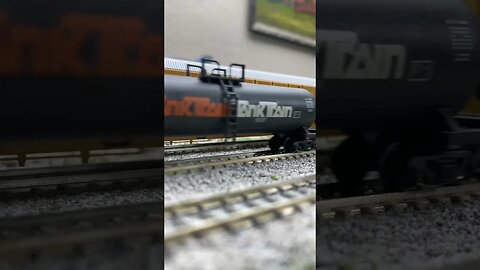 BLI RSD15s passing a local train on a siding.