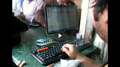 Receptionist at a busy pharmacy in India